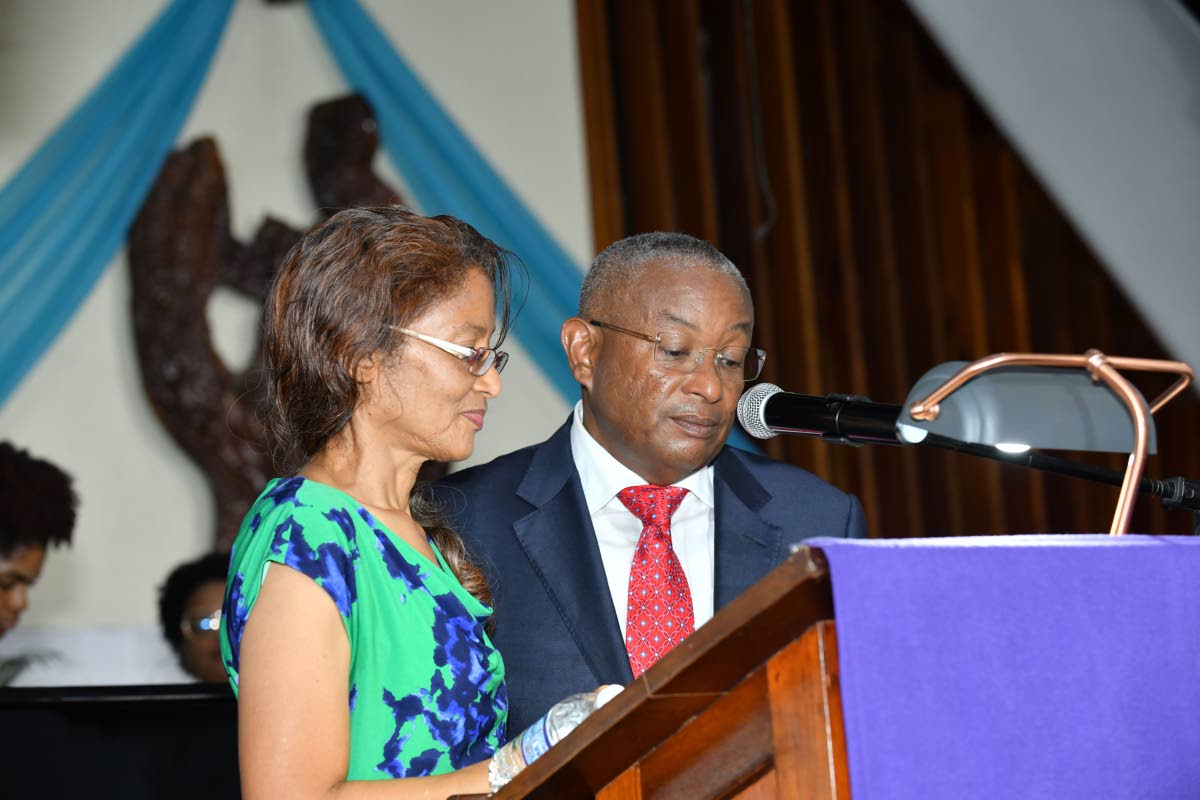 Siblings Dr Frances Berry (left) and Mayberry Executive Vice Chairman Konrad Mark Berry (right) deliver the eulogy during the funeral for Doris ‘May’ Berry, founding director of Mayberry Investments Limited, at the Webster Memorial United Church on Mon