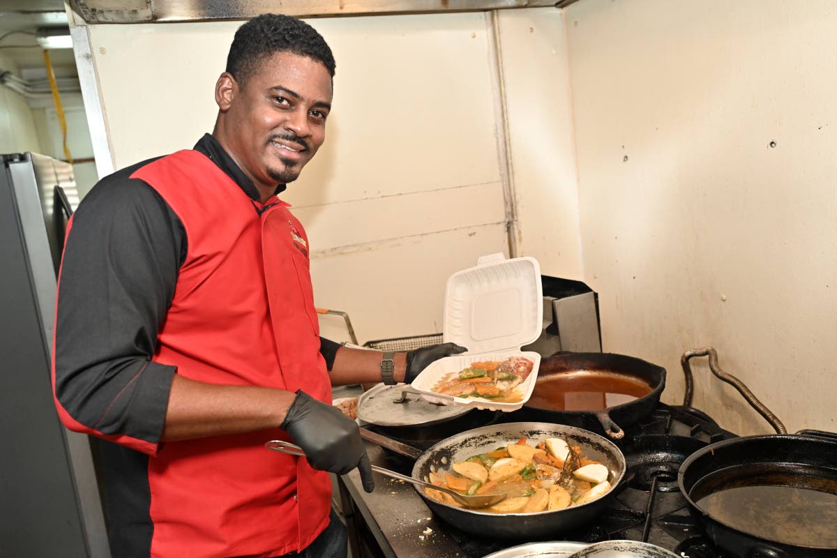 Chef Simpson prepares an order of freshly prepared steamed fish.