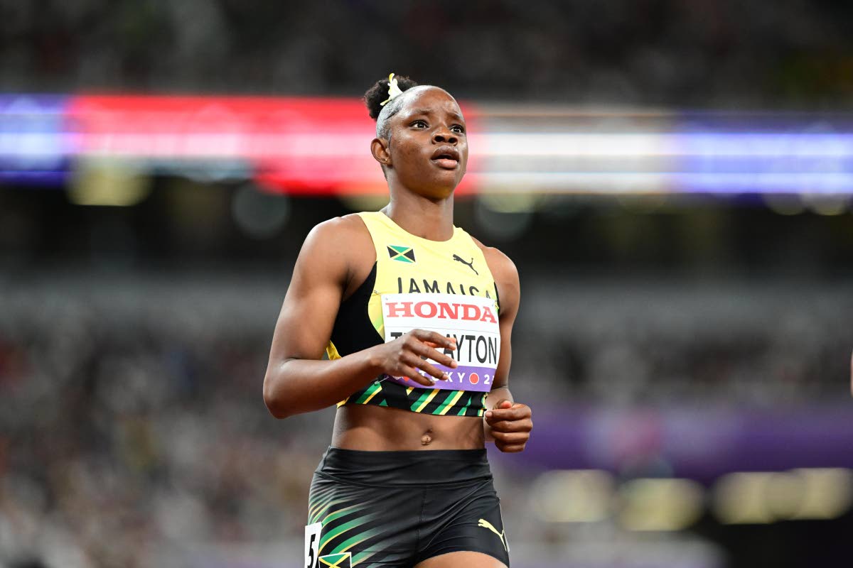 Tina Clayton comes through the line during 100-metre heat at the World Athletics Championships inside the Japan National Stadium in Tokyo yesterday.