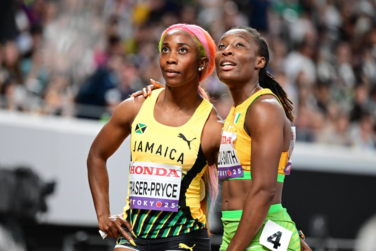 Jamaica’s Shelly-Ann Fraser-Pryce (left) and Cote diVoire’s Marie Josee Talou Smith look at the monitor during a 100-metre heat at the World Athletics Championships inside the Japan National Stadium in Tokyo yesterday.