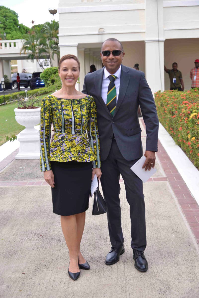 Senator Kamina Johnson Smith and husband, Jason Smith, coordinate with the colours of the national flag. 