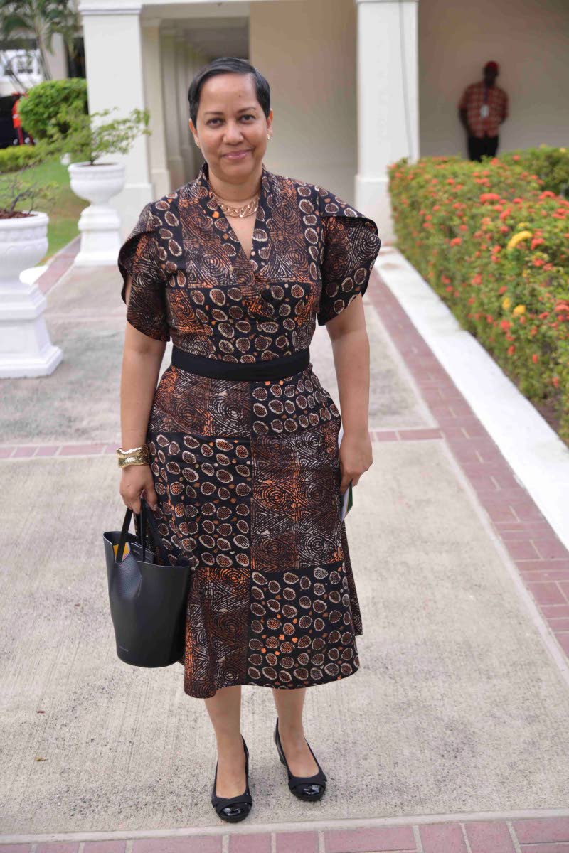 Resident representative at the Organization of American States, Jeanelle van Glaanen Weygel, pairs her patterned belted dress with classic black accessories.
