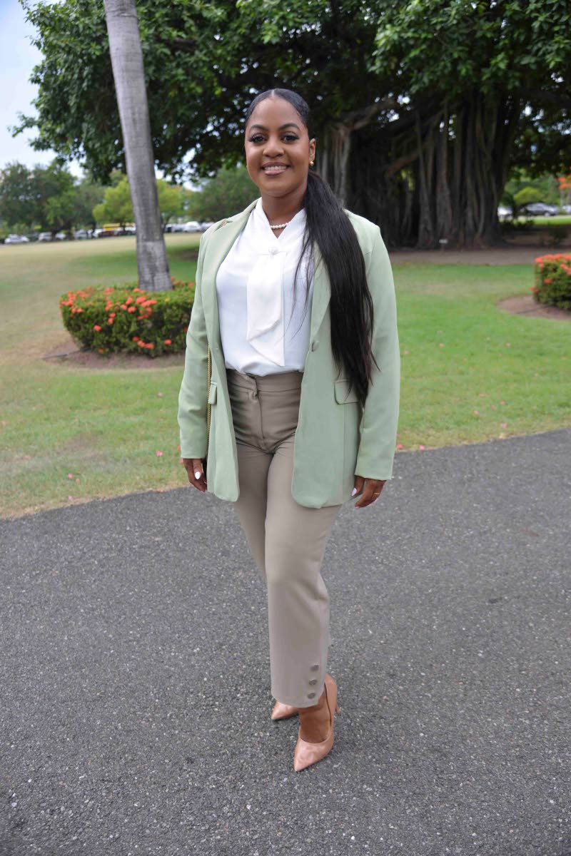  Former Councillor Kari Douglas opts for a sage blazer layered over a white blouse and tailored trousers, and grounded by nude pumps.