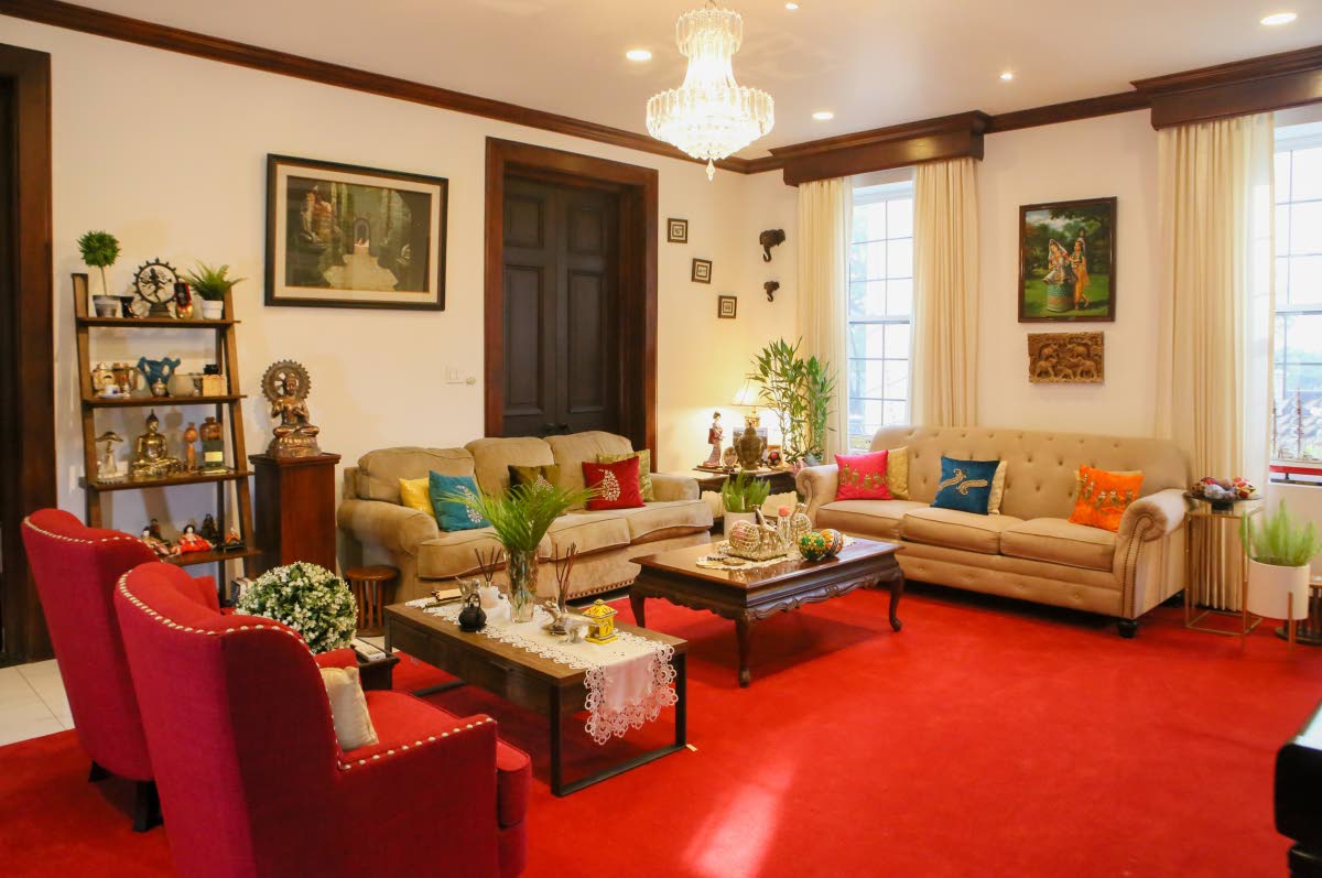 The living room showcases the vibrancy and traditions of Indian decor.