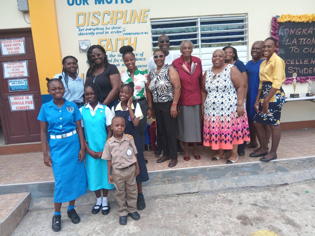 Donors, recipients, parents and teachers during a ceremony at Glowell  Preparatory  School  in  Cedar  Grove,  Portmore, St Catherine. 