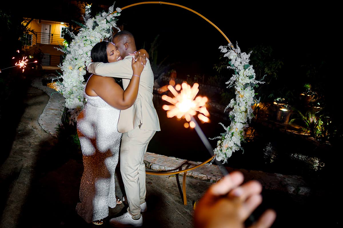 The newly-weds share an official first dance to their favourite song, ‘For You’ by reggae singer, Dennis Brown. 