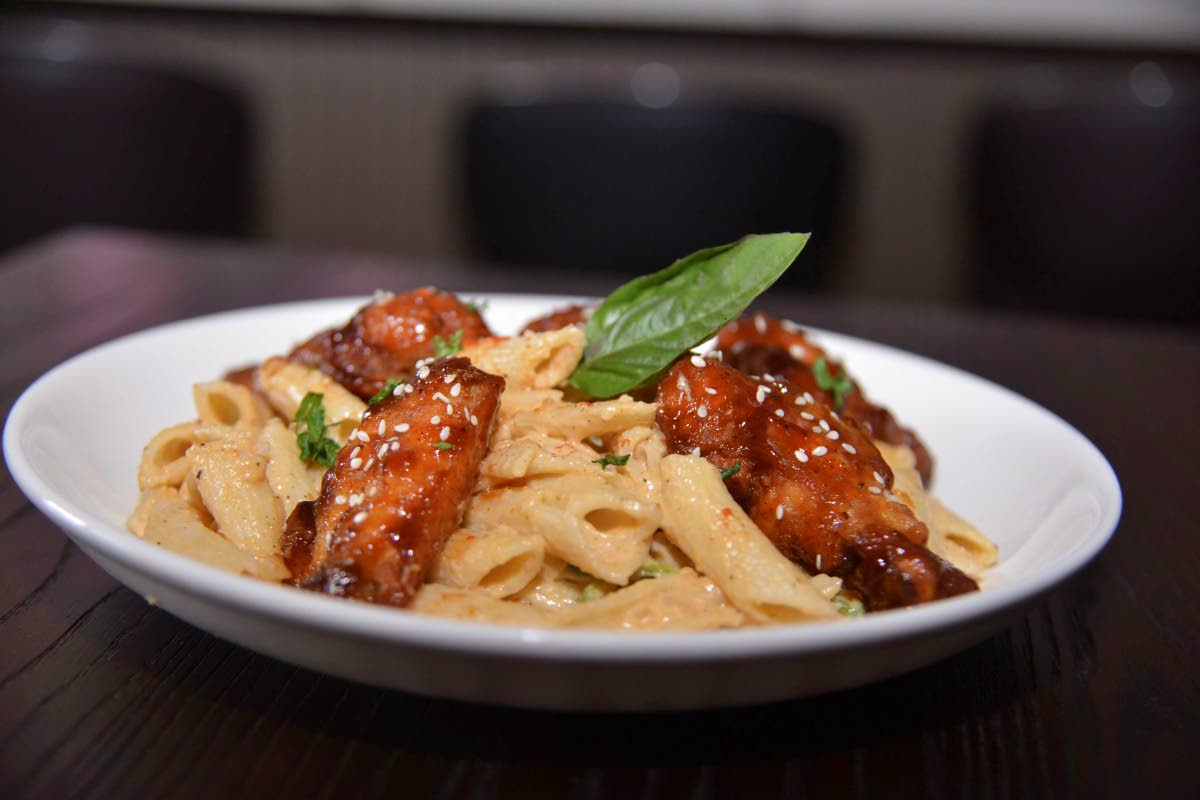 Azi’s Pasta Plates’ pasta and honey barbecue wings combo, topped with sesame seeds, brings together creamy comfort and crunchy sesame flavour in a crowd-favourite dish.