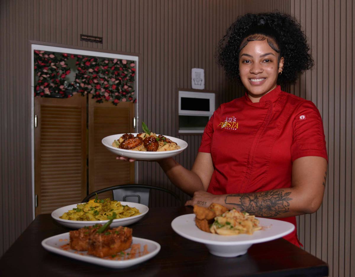 Asia Thomas, owner of Azi’s Pasta Plates, showcases some of her signature creations, including the curried goat pasta, fried pasta squares, basa fish fillet pasta, and the pasta and sesame seed wings combo.