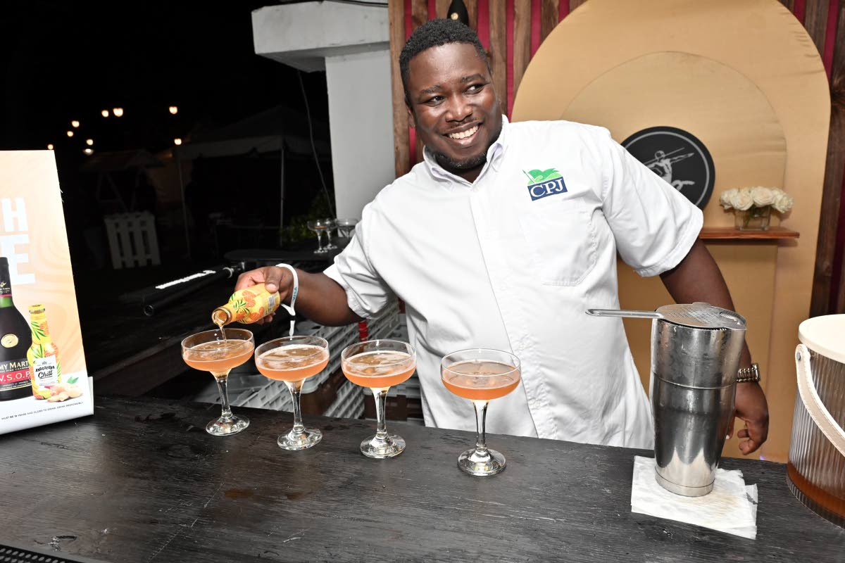 Mixologist Lorenzo Hall puts on a show, preparing these Rémy Martin French mule cocktails.
