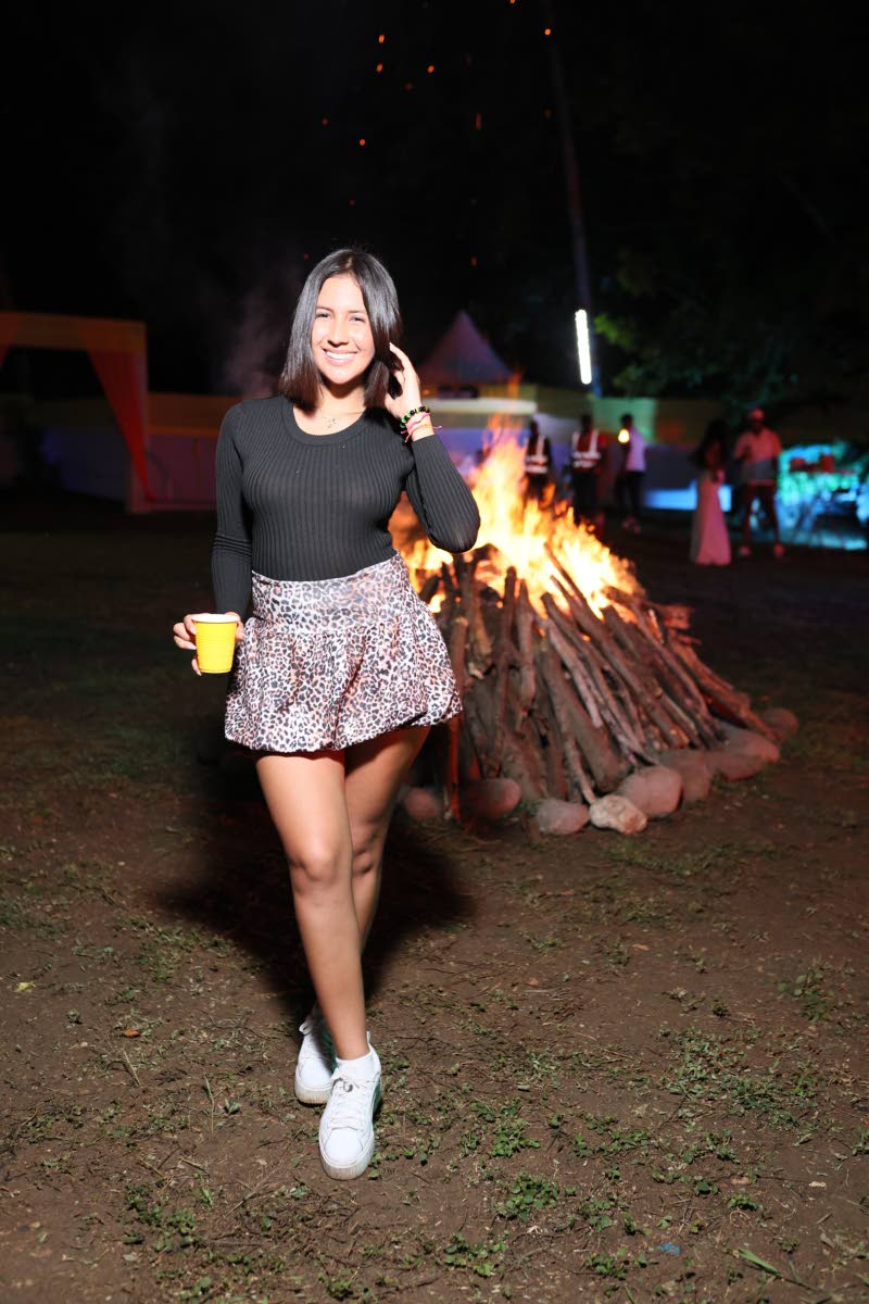 Venezuelan nurse Irene Valentina pairs a ribbed black top with a leopard-print mini skirt and crisp white lowtops.