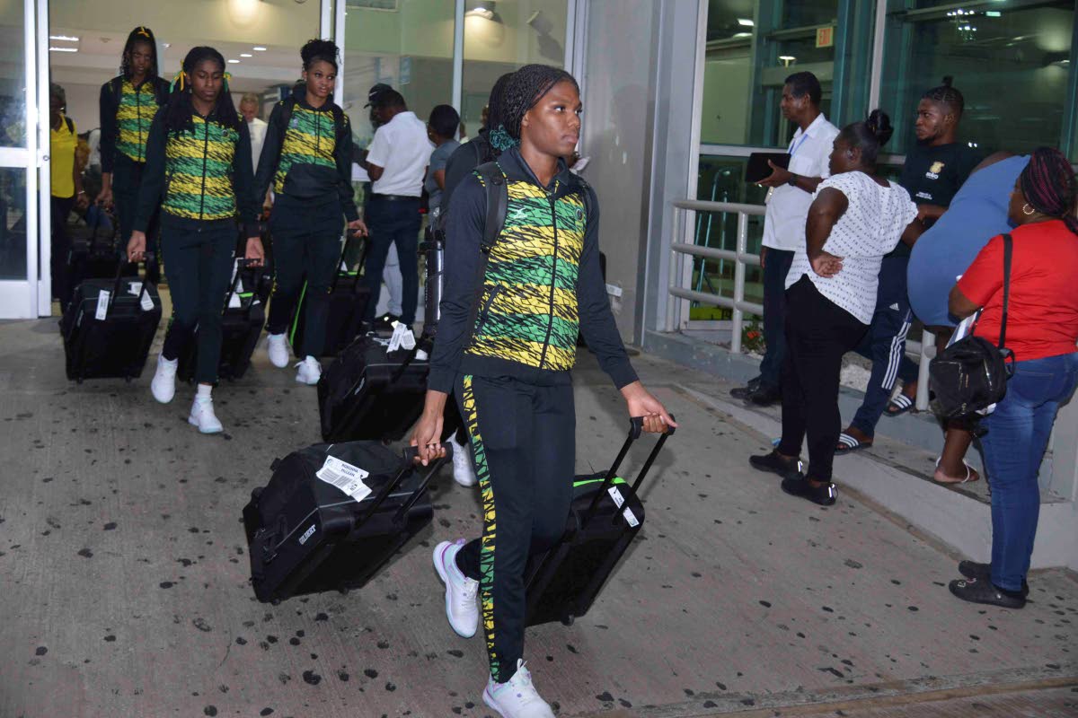 Jamaica’s under-21 Sunshine Girls arrive in island through the Norman Manley International Airport yesterday after their exploits at the World Netball Youth Cup in Gibraltar.