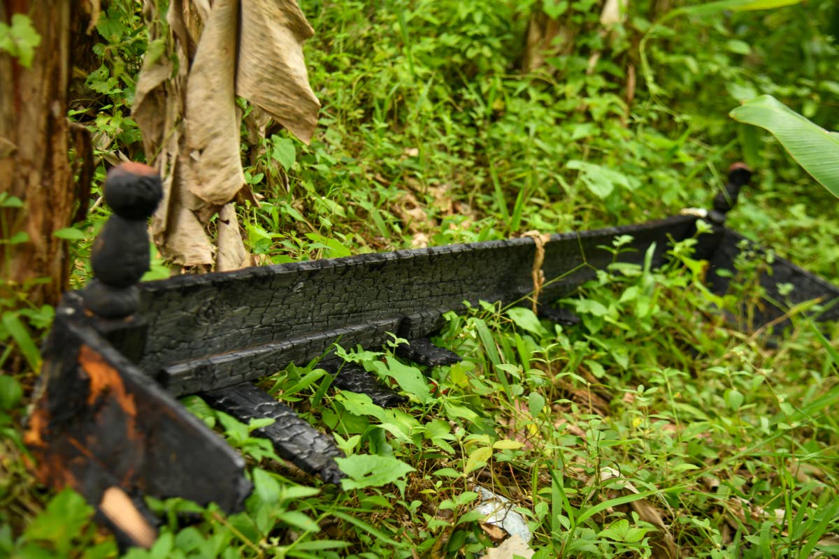 Photo of a burnt bed frame found outside the home.