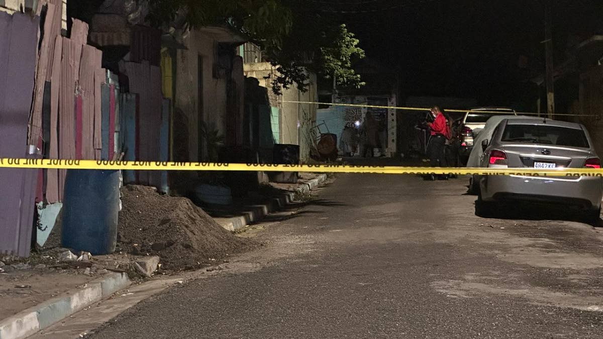 The scene of a drive-by shooting on Text Lane in central Kingston on Tuesday night. In the incident, four minors, including two children under age 10 and two teenagers, were among six people shot.
