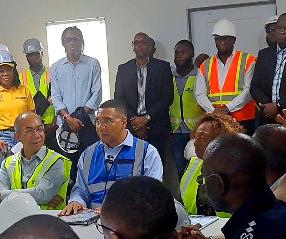 Prime Minister Dr Andrew Holness (centre) is flanked by National Security Minister Horace Chang (left) and St Catherine Central Member Parliament Olivia Grange following a tour of the multimillion-dollar St Catherine North Divisional Headquarters in Spanis