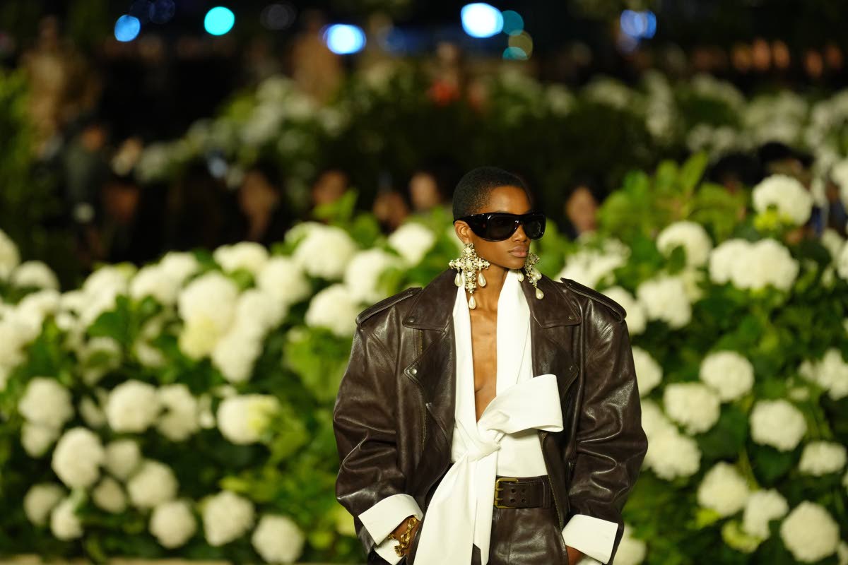 A model wears a broad-shouldered leather jacket from Saint Laurent’s Spring/Summer 2026 collection in Paris, embodying the season’s return to sharp tailoring and powerful silhouettes. 