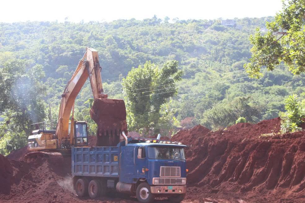 Bauxite being loaded onto a truck in the mines.