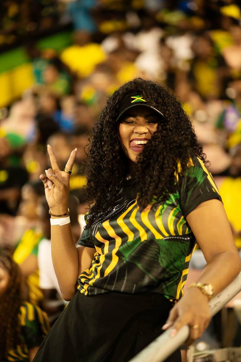 Kerry-Ann ‘Chiney K’ Collins gets playful with the cameras while enjoying the halftime entertainment.