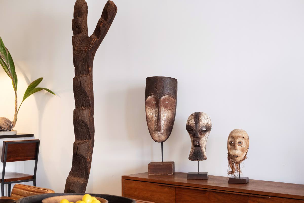 From left: Dogon ladder, from Mali; Fang mask, from Gabon and a Kifwebe mask and Lega mask, both from Congo.