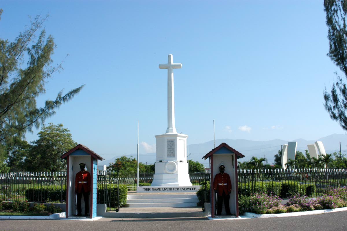 Members of the 2nd Battalion of the Jamaica Regiment stand guard outside of the cenotaph of the National Heroes Park in 2005.