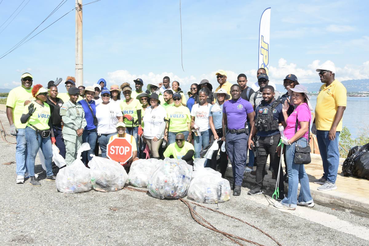 Representatives from JPS, National Environment and Planning Agency (NEPA), Independent Cadet Unit, Courtyard Marriott and members of the Jamaica Constabulary Force following the beach cleanup activity at Sturridge Park mangrove site in Kingston 