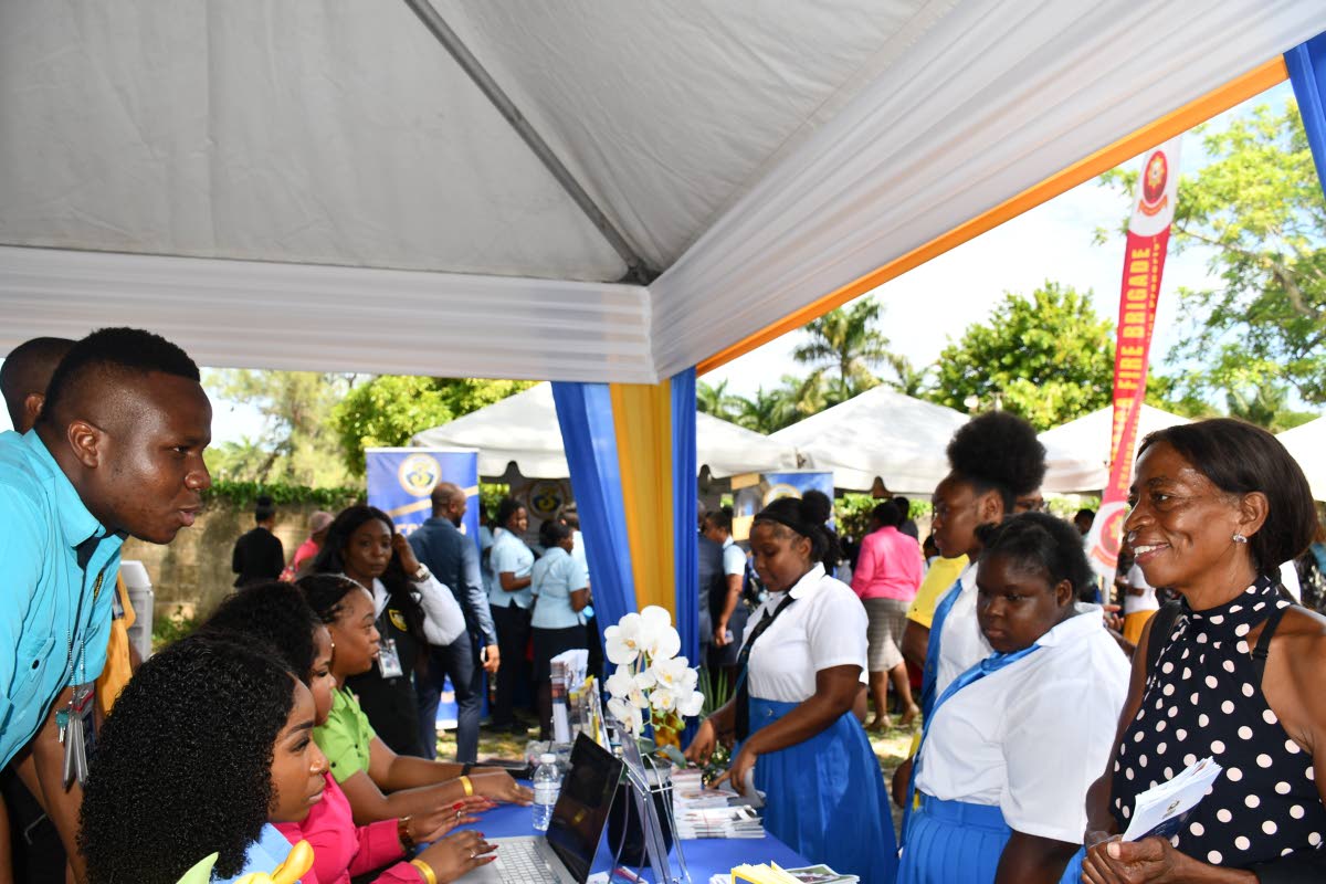 Team members of the Jamaica Customs Agency engage students and members of the public at the Court Administration Division’s Public Education Day Symposium on October 8 in St Ann.