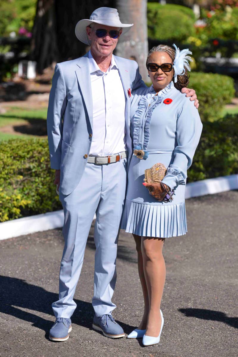 Marketing consultant Paul Hinkle and Deanna Christensen of Bahamas Investment and Consultants, both stylish in blue, pause for a quick photo.