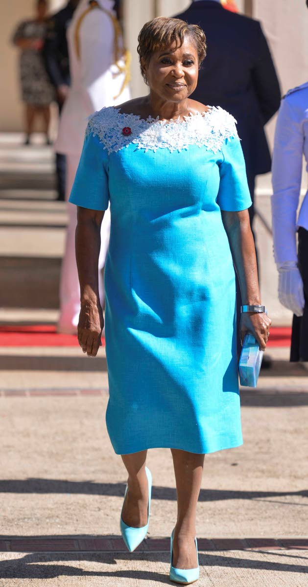 Lady Patricia Allen is poised in an eye-catching, head-to-toe sky-blue ensemble.