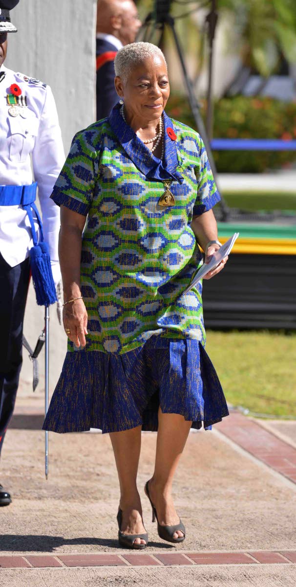 Ambassador Sandra Grant Griffiths, chief of state protocol, dons an African geometric print garment for this special occasion.