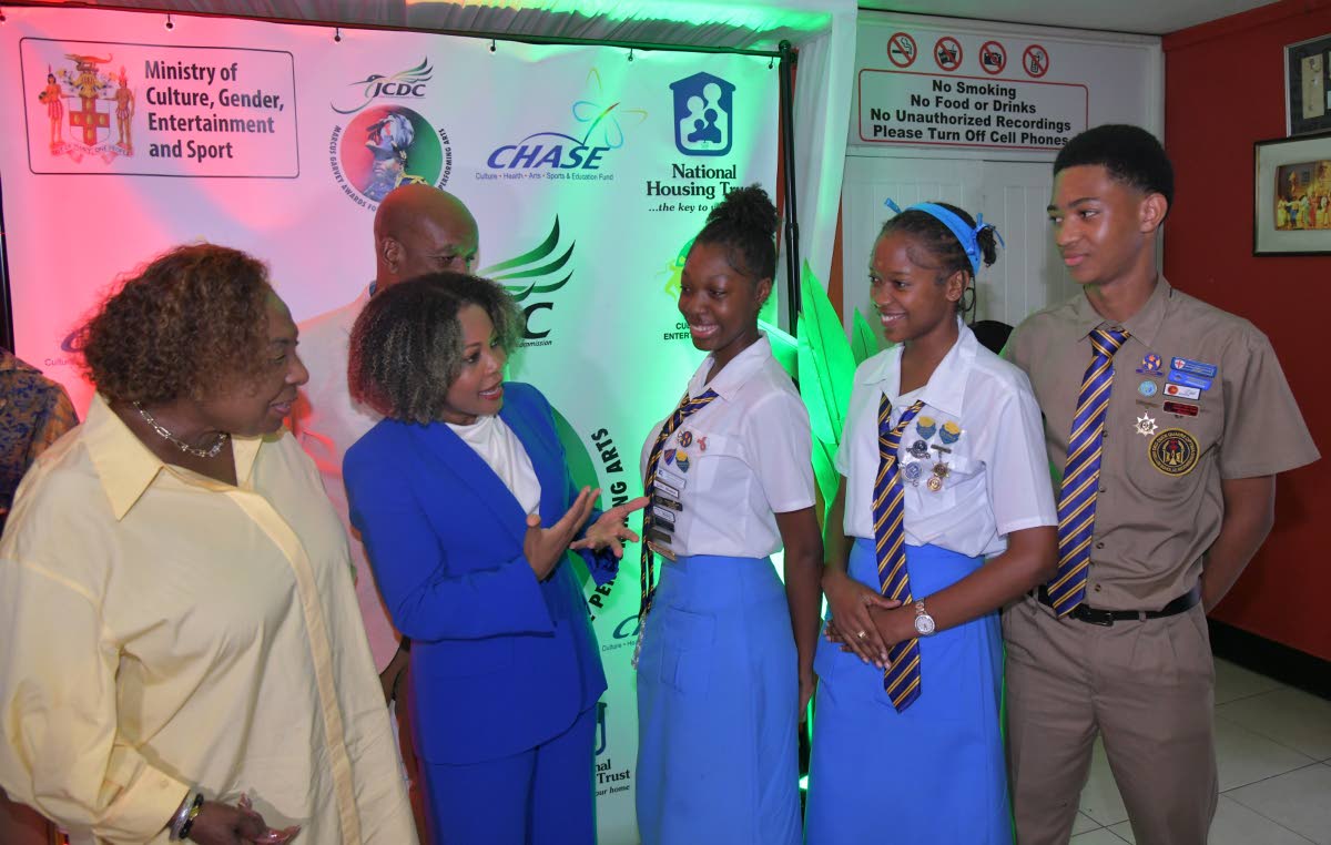 Minister of Culture, Gender, Entertainment and Sport, Oliva Grange (left), and Minister of Education, Skills, Youth & Information, Senator Dr Dana Morris Dixon (second left), engage with members of the Ardenne High School Drama Club. Occasion was the JCDC 