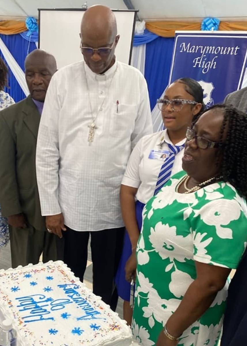 From left: Rev Rudolph Summerville, board chairman, Archbishop Kenneth Richards, Mahalia Plunket, senior prefect, and Lorna Bailey, immediate past principal.
