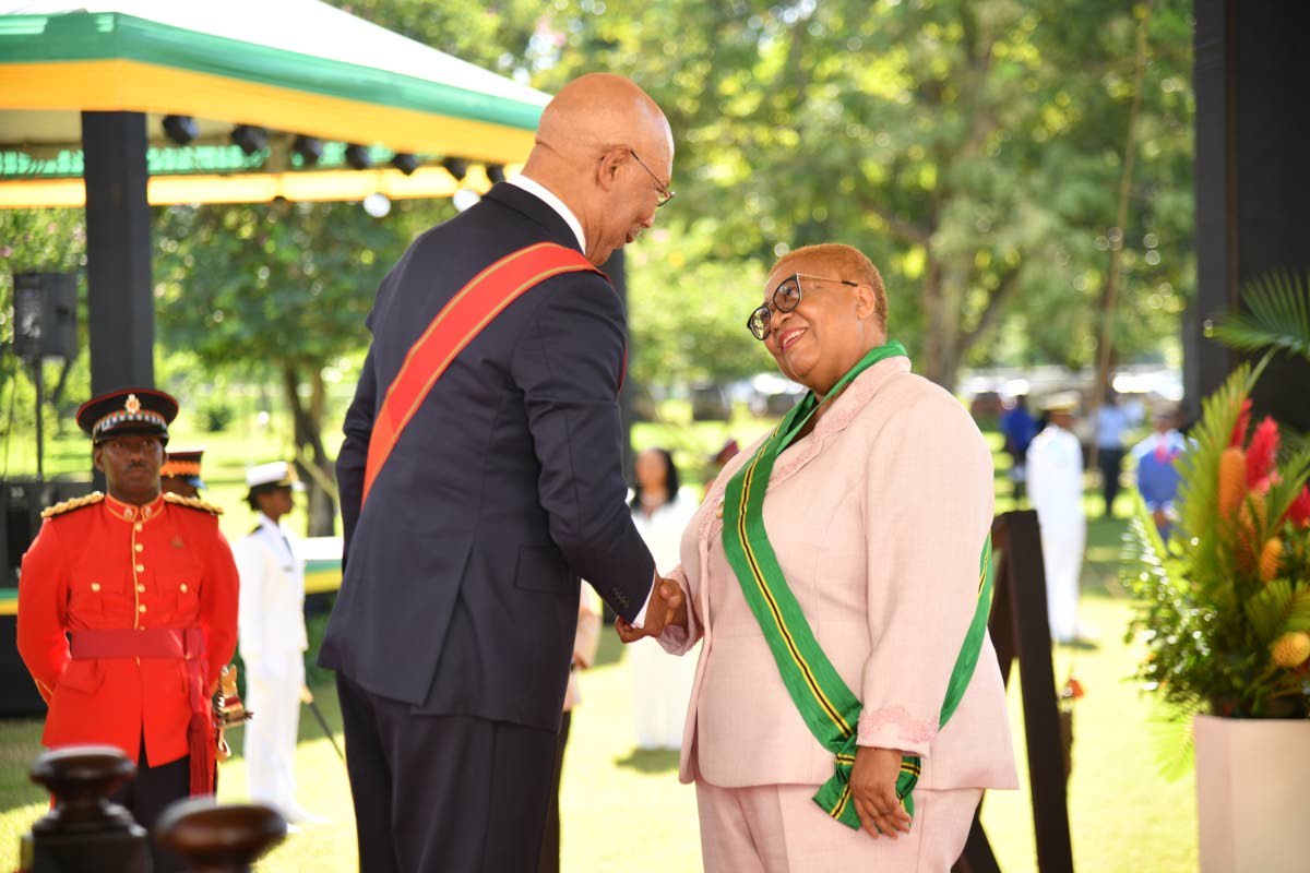 Marlene Street Forrest, recipient of membership in the Order of Jamaica with Governor General Sir Patrick Allen. 