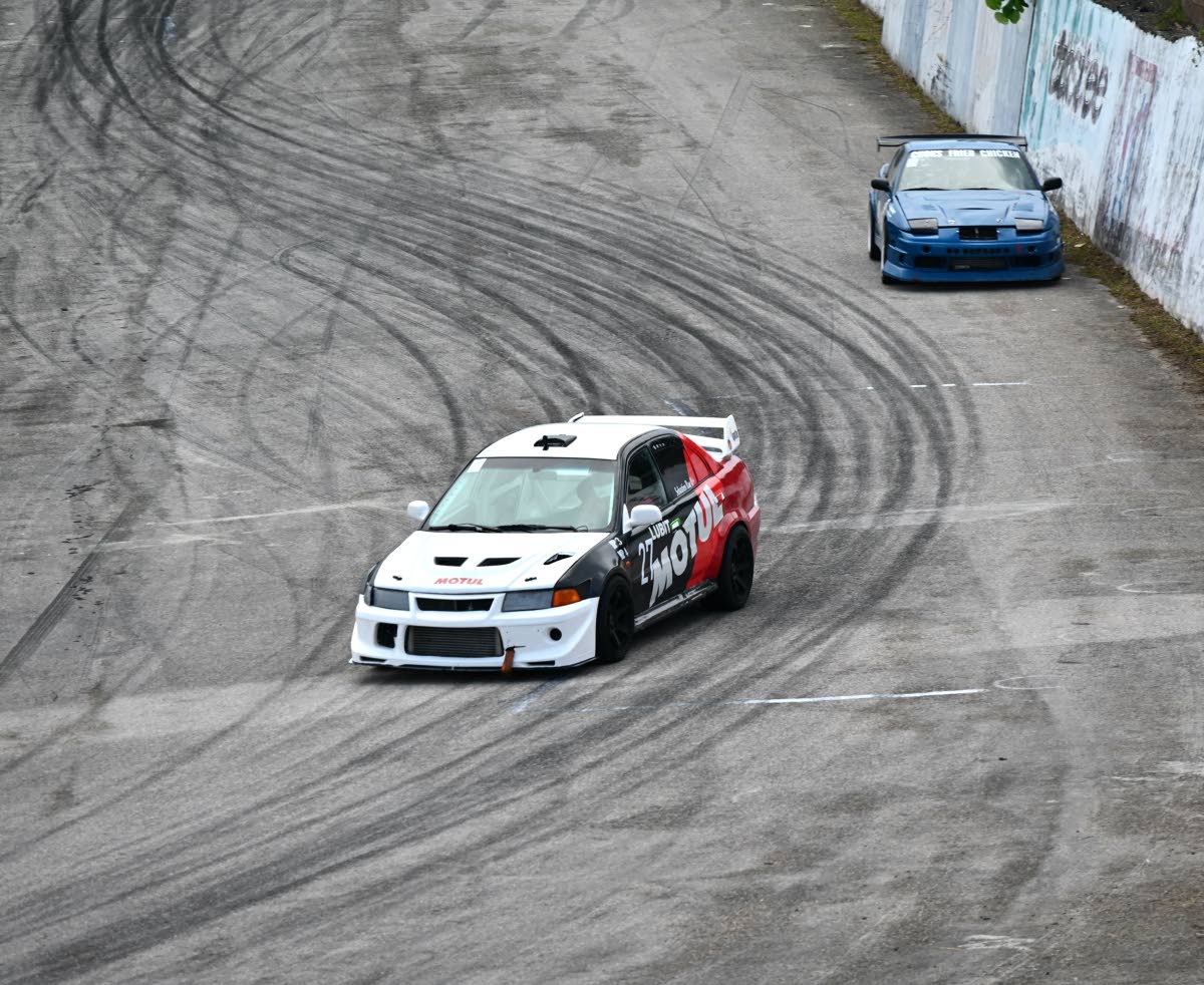 Sebastian Rae (left), driving his Mitsubishi Lancer 6 1/2 Tommi Mäkinen Edition during Heroes of Speed at the Dover Raceway in St Ann on Monday.