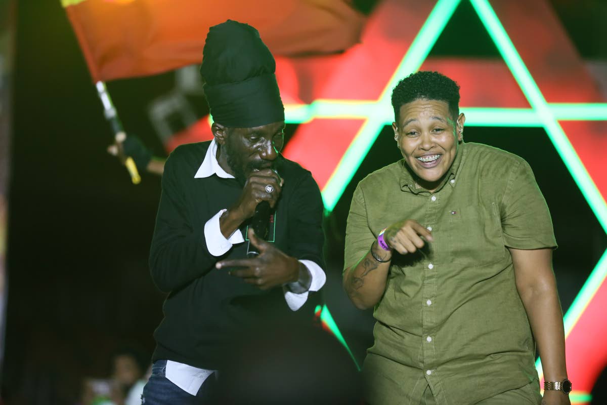 Sizzla Kalonji is joined by Antoinette Aiken, one of three sign language interpreters who worked at the Rise to the Occasion concert.