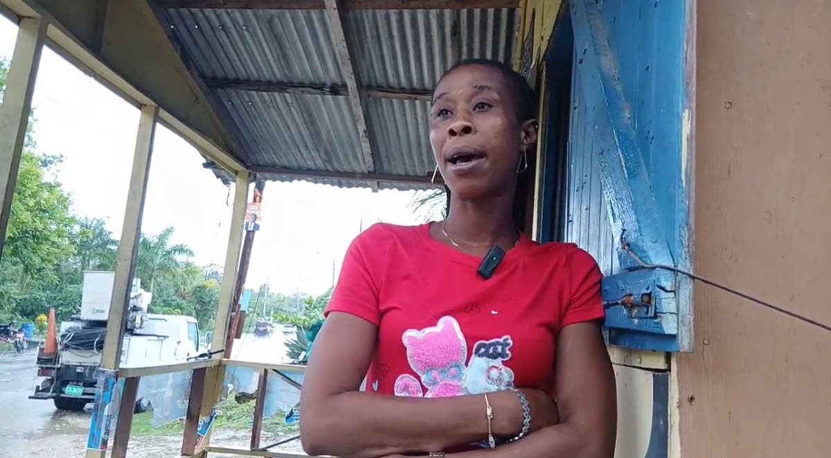 Sheron, who lives at Bay Road, says she remains anxious as heavy rain and blocked drains worsen the impact of early flooding ahead of the approaching tropical storm.