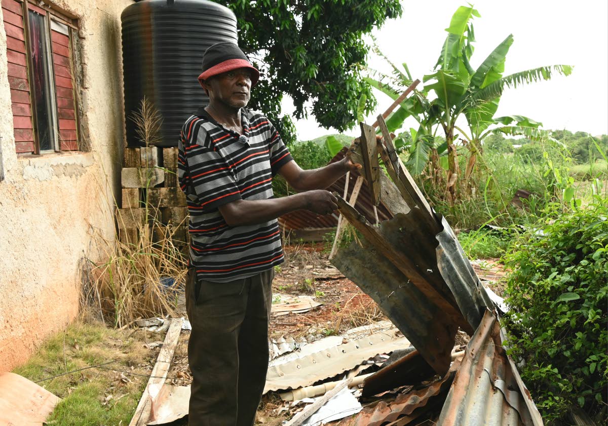 Micah Williams, tomato farmer from Flagaman in St Elizabeth, shows items used to shield him during Hurricane Beryl in 2024 at his home. Williams yesterday made a desperate plea for help as he prepares for Tropical Storm Melissa which is expected to make la