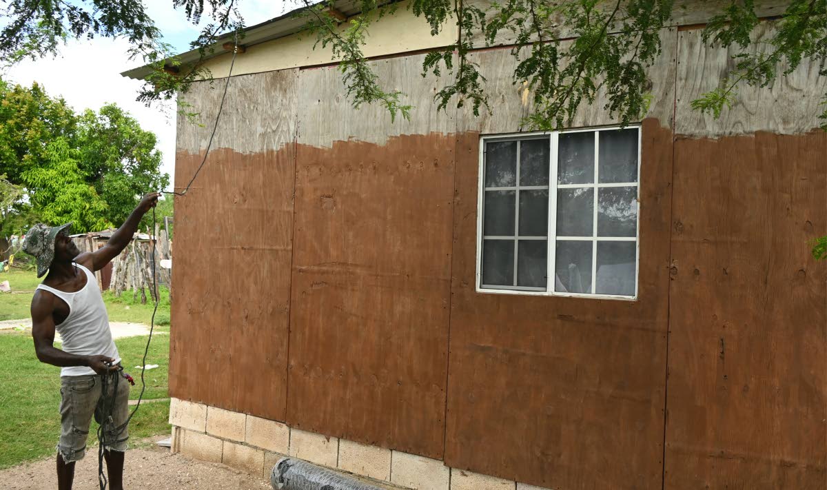 Castell Wright tying down the roof of his home in Parottee, St Elizabeth, last Friday in preparation for Hurricane Melissa, which is expected to make landfall early this week.