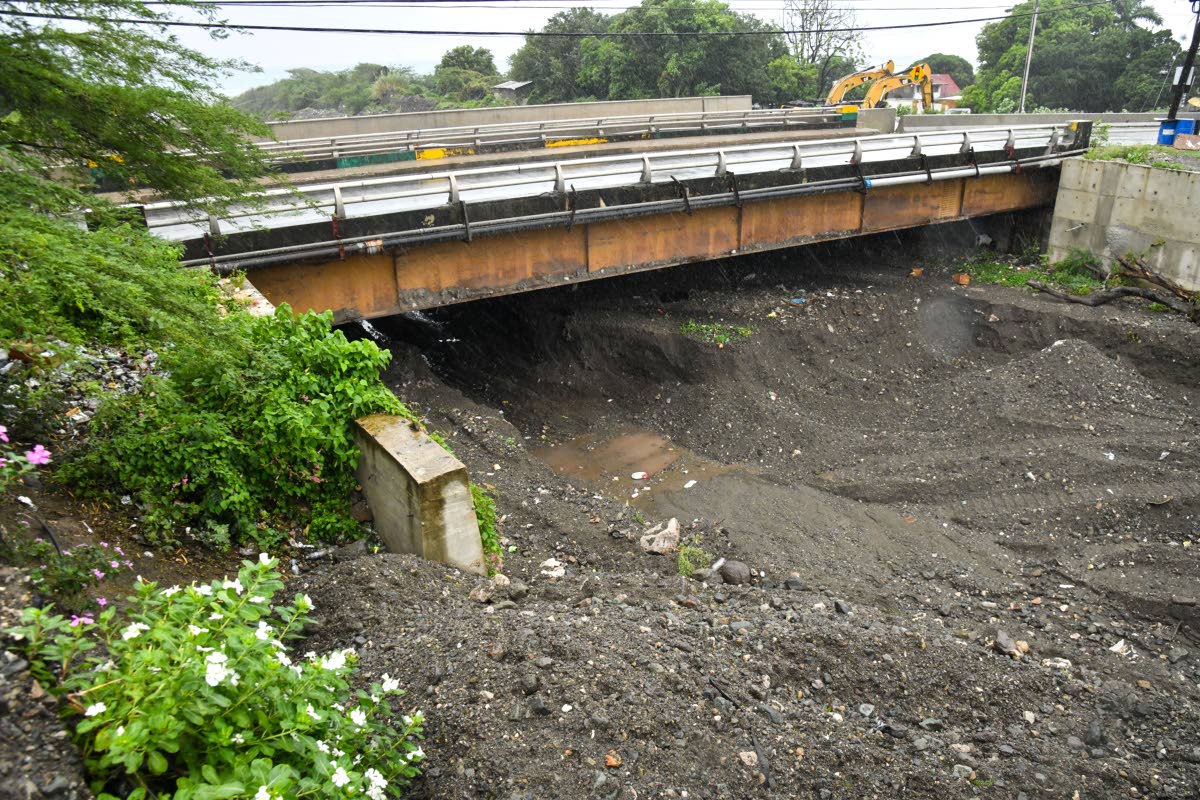 A section of the Chalky River bed in Bull Bay, St Andrew, which had begun being cleared but has subsequently not been finished, to the dismay and concern of residents in the area of Weise Road yesterday.