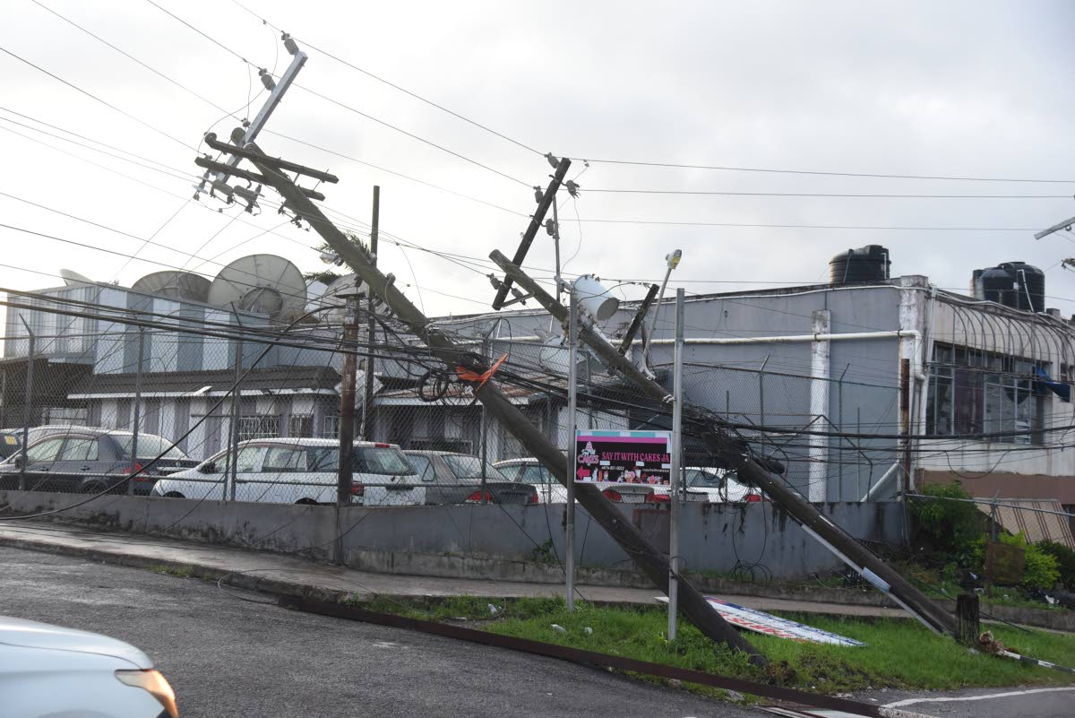 Toppled JPS utility poles are seen along Hargreaves Avenue in Mandeville after Hurricane Melissa swept through Jamaica last month.