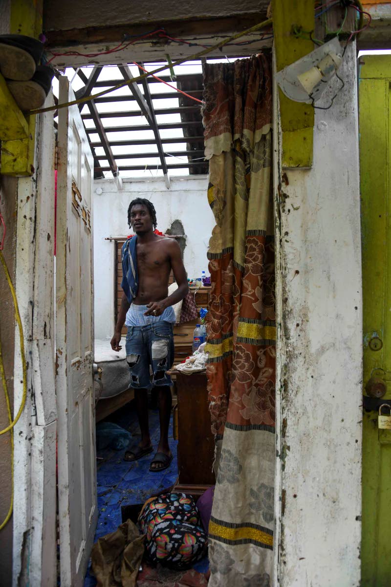 Nagano East, a resident of Cornwall Street, Compound in Trelawny shows the damage done to his home by Hurricane Melissa.