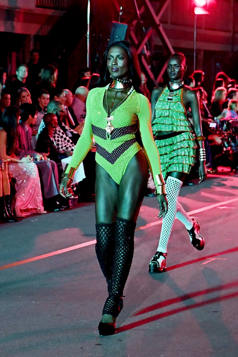 Actress Jodie Turner-Smith wears a custom Diotima bodysuit at the Vogue World 2025: Hollywood show on October 26 as model Abény Nhial follows behind her.