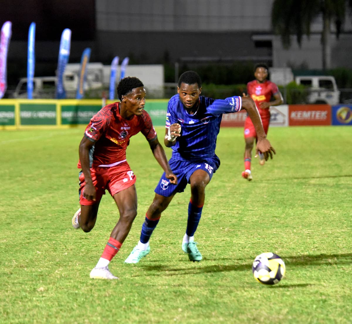 Montego Bay United’s Nashordo Gibbs tries to outrun Spanish Town Police FC’s Jason Clarke during their Jamaica Premier League football match at the Montego Bay Sports Complex on September 28. 