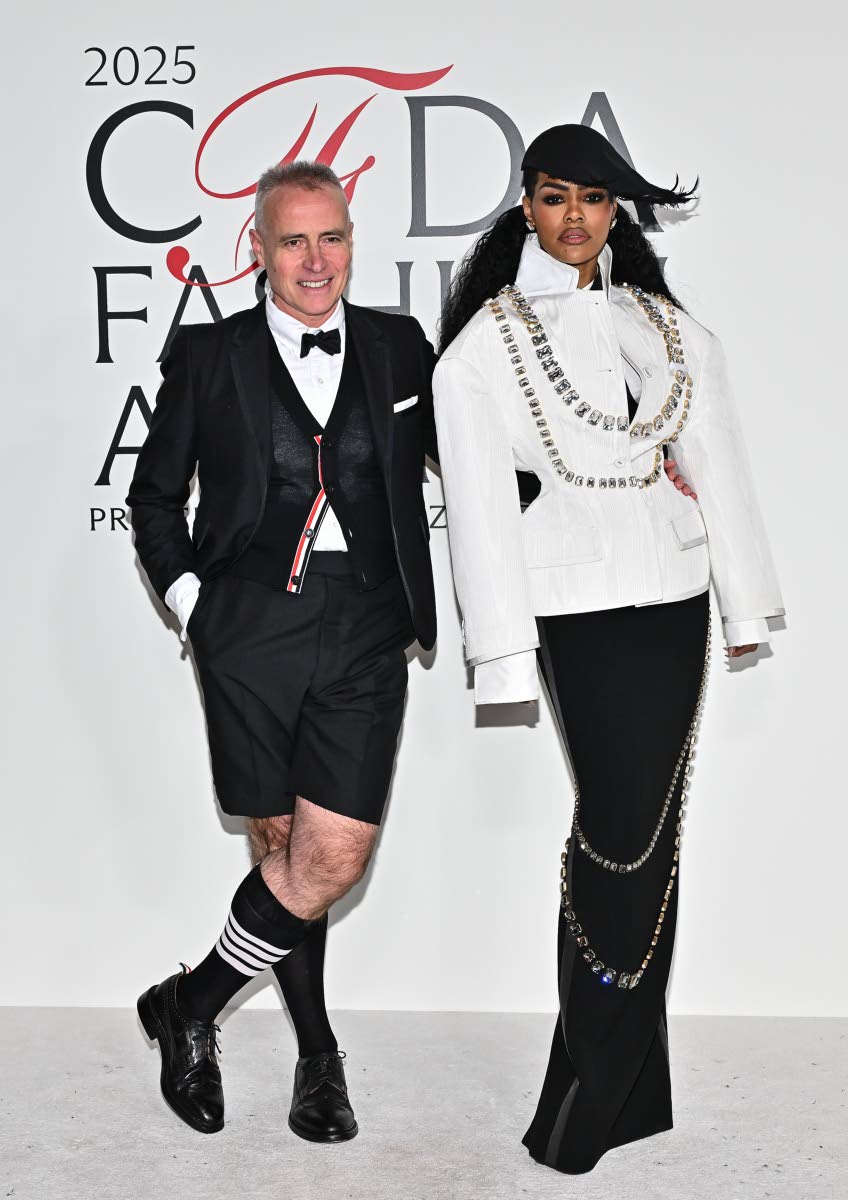 Teyana Taylor poses with designer, Thom Browne, wearing a look from his eponymous brand.