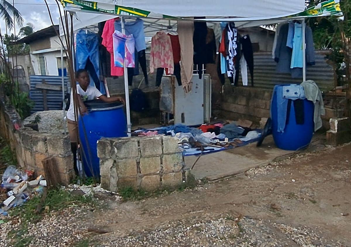 Wet clothes hanging out to dry in Ernstvon Gibbs’ front yard in Shady Grove. 