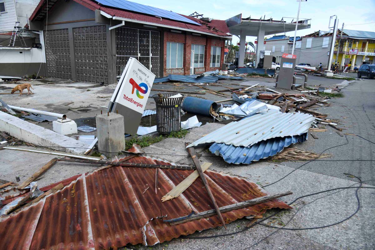 Debris lays in front of the Total gas station on Market Street in Falmouth, Trelawny, on October 29, after the passage of Hurricane Melissa, which swept through the island on October 28.