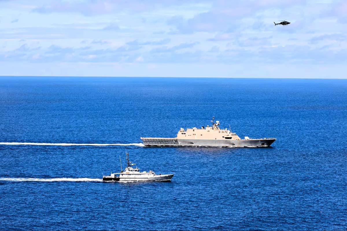  USS Wichita and HMJS Cornwall sail in formation during a live-fire exercise on April 9, 2021.