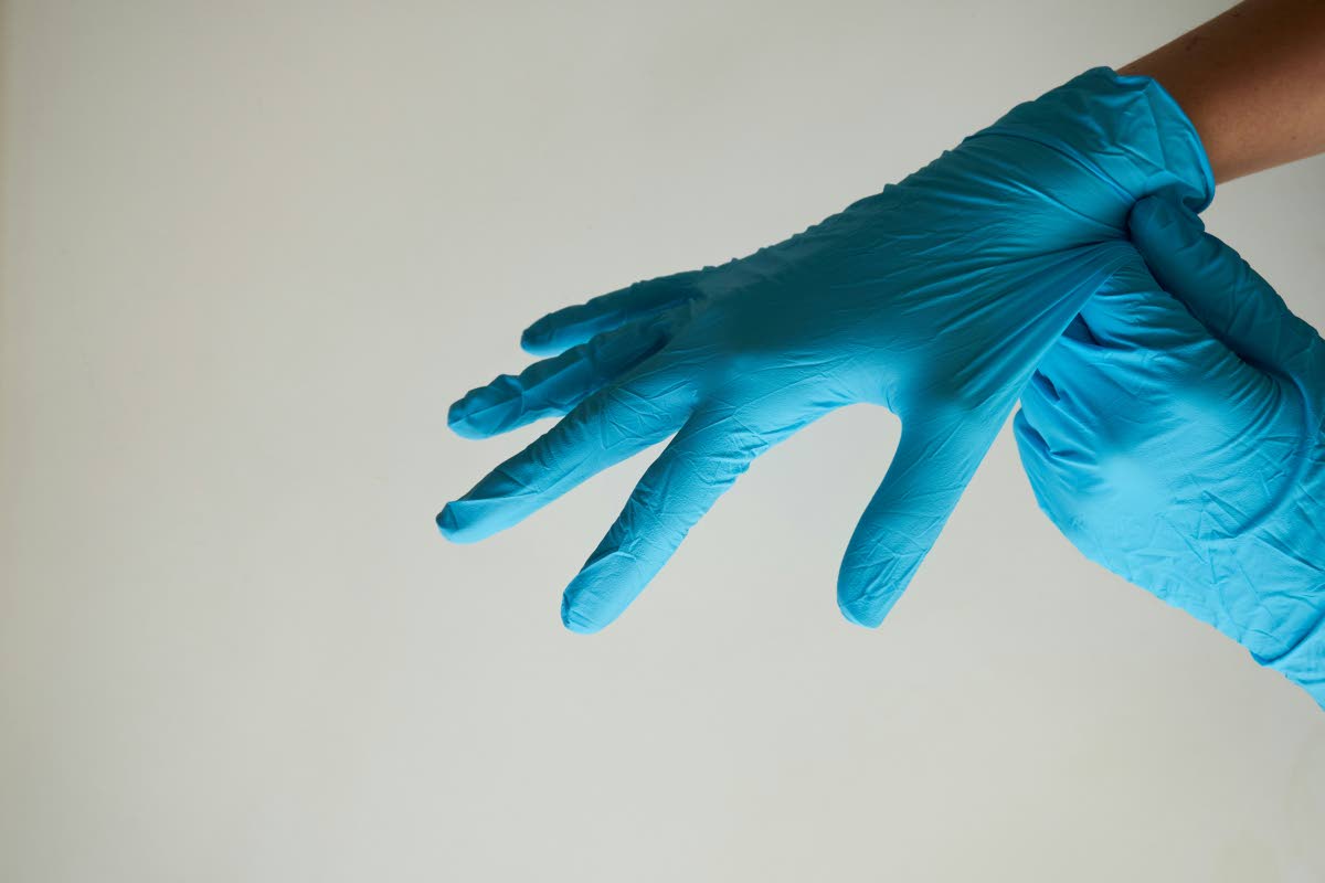 Always wear protective gloves and thick-soled, closed-toe boots when cleaning up.