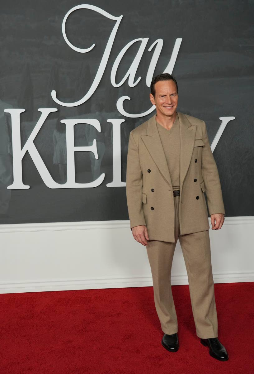 Patrick Wilson keeps it neutral in a double-breasted jacket and matching camel shirt.