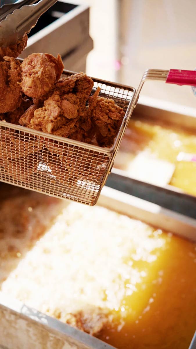 Golden-brown fried chicken was among the meal options that included curried chicken, curried fish, and a vegetable stew.