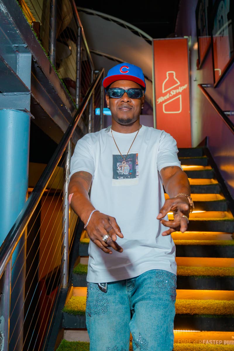  Pausing hosting duties for a moment, popular disc jockey Bishop Escobar steps aside to pose for a photo.