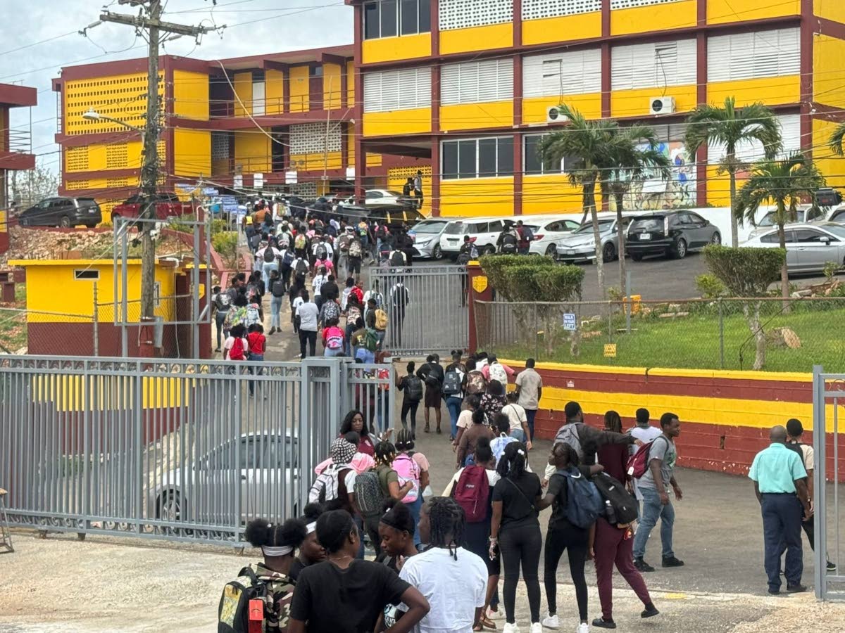 Students returning to school at Holmwood Technical in Christiana, Manchester, last week.